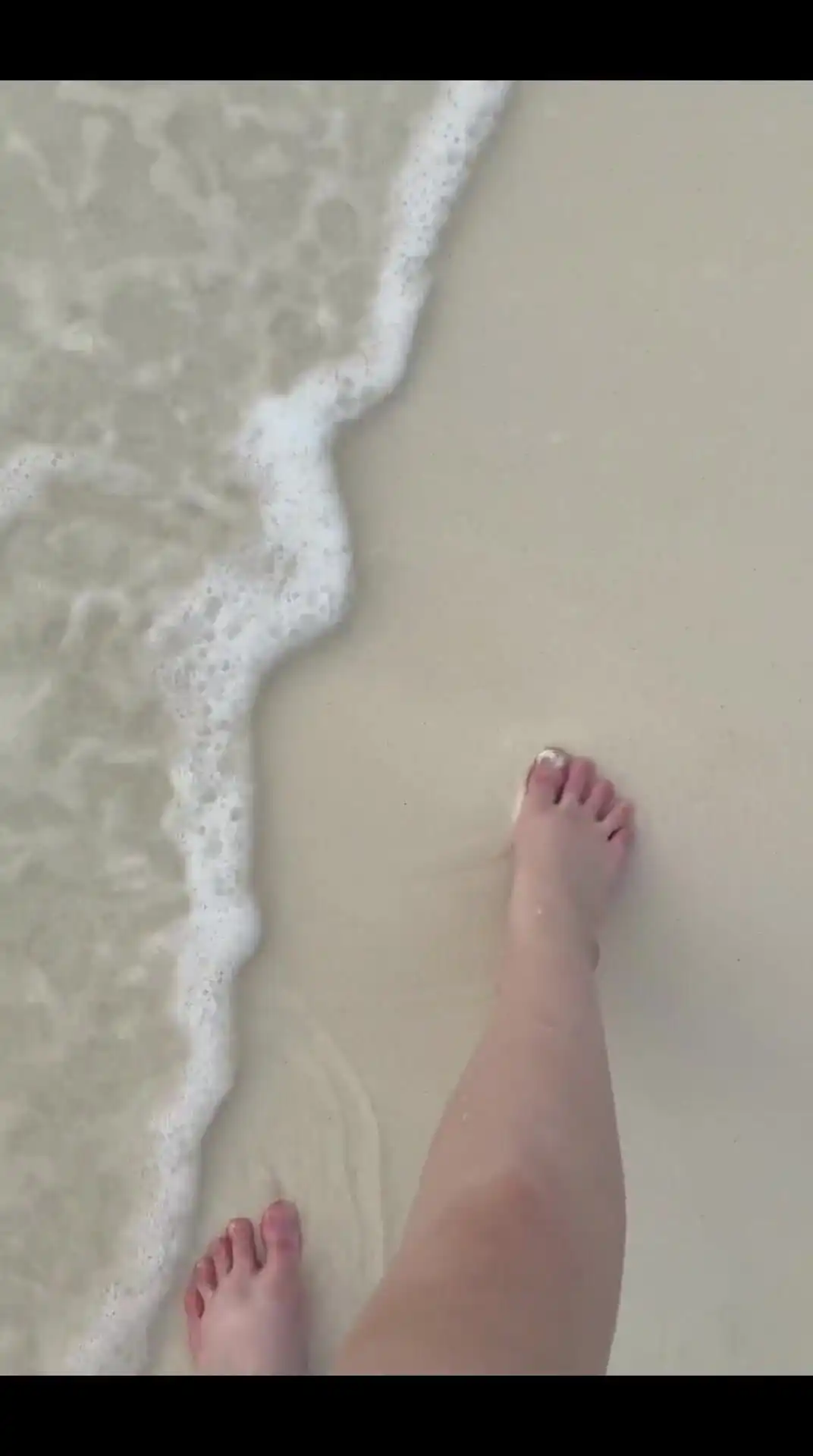 Running my bare feet on the white beach sand by the ocean.