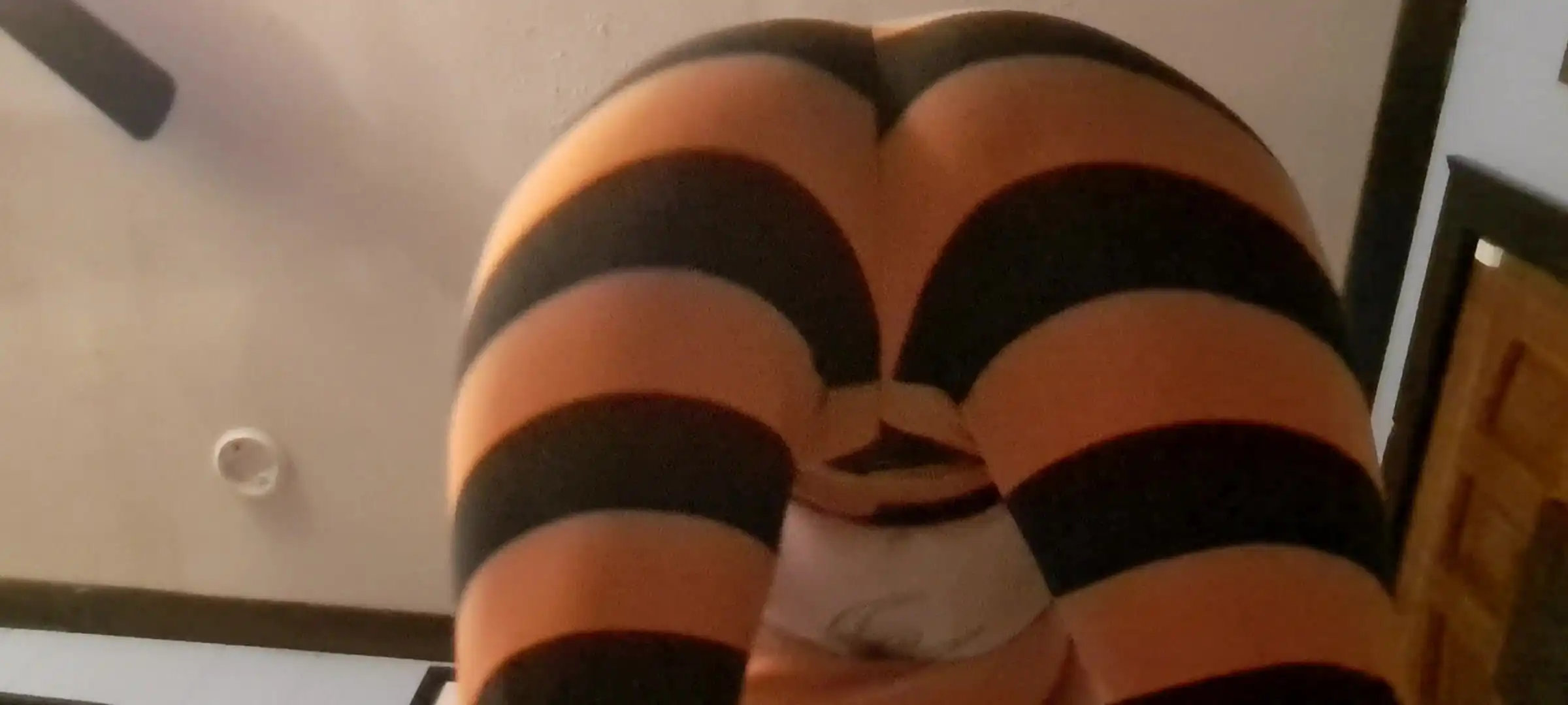 Squatting in Halloween Leggings