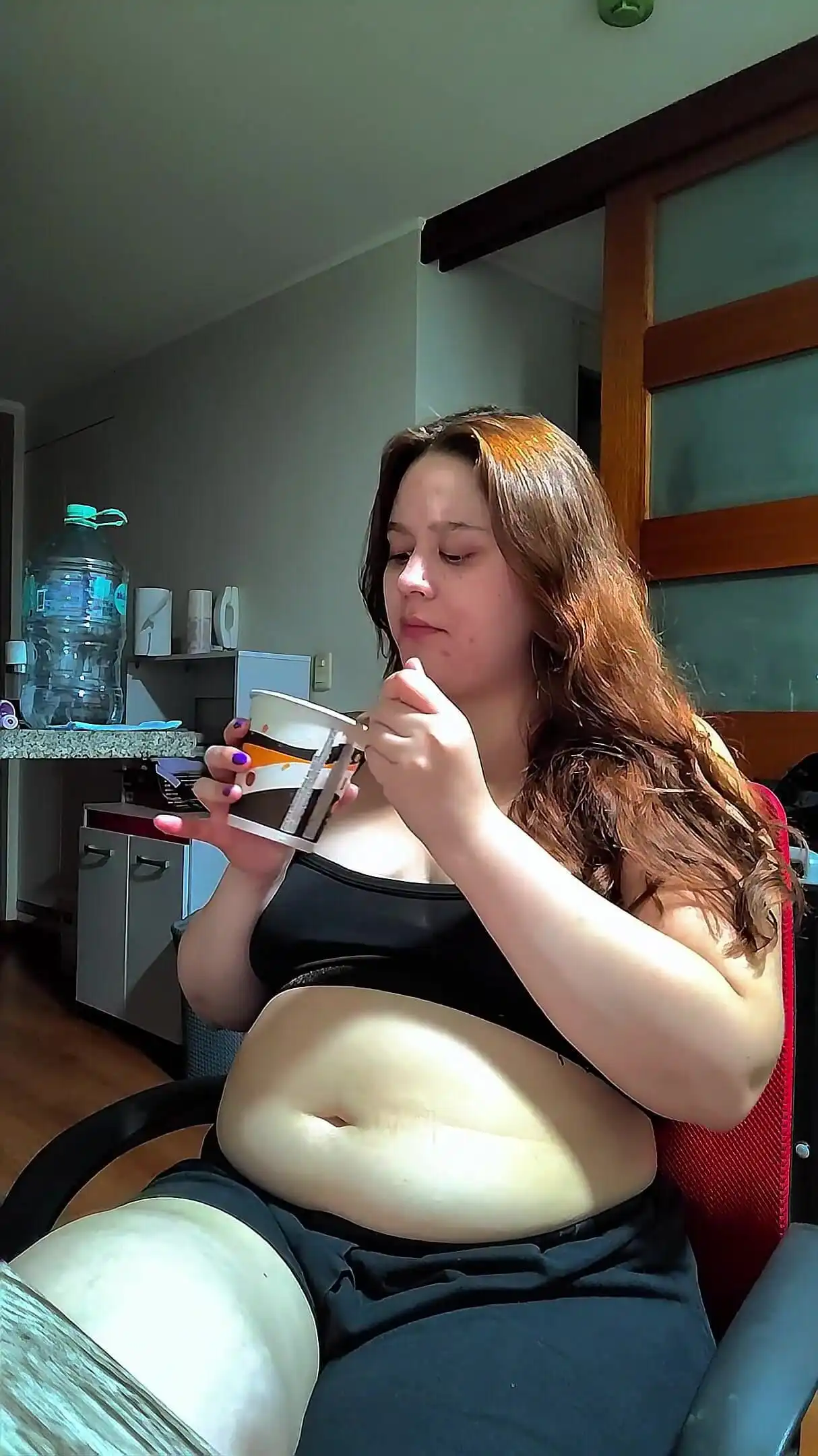 Hot Chubby Woman Filling Her Round Belly with Some Sweets