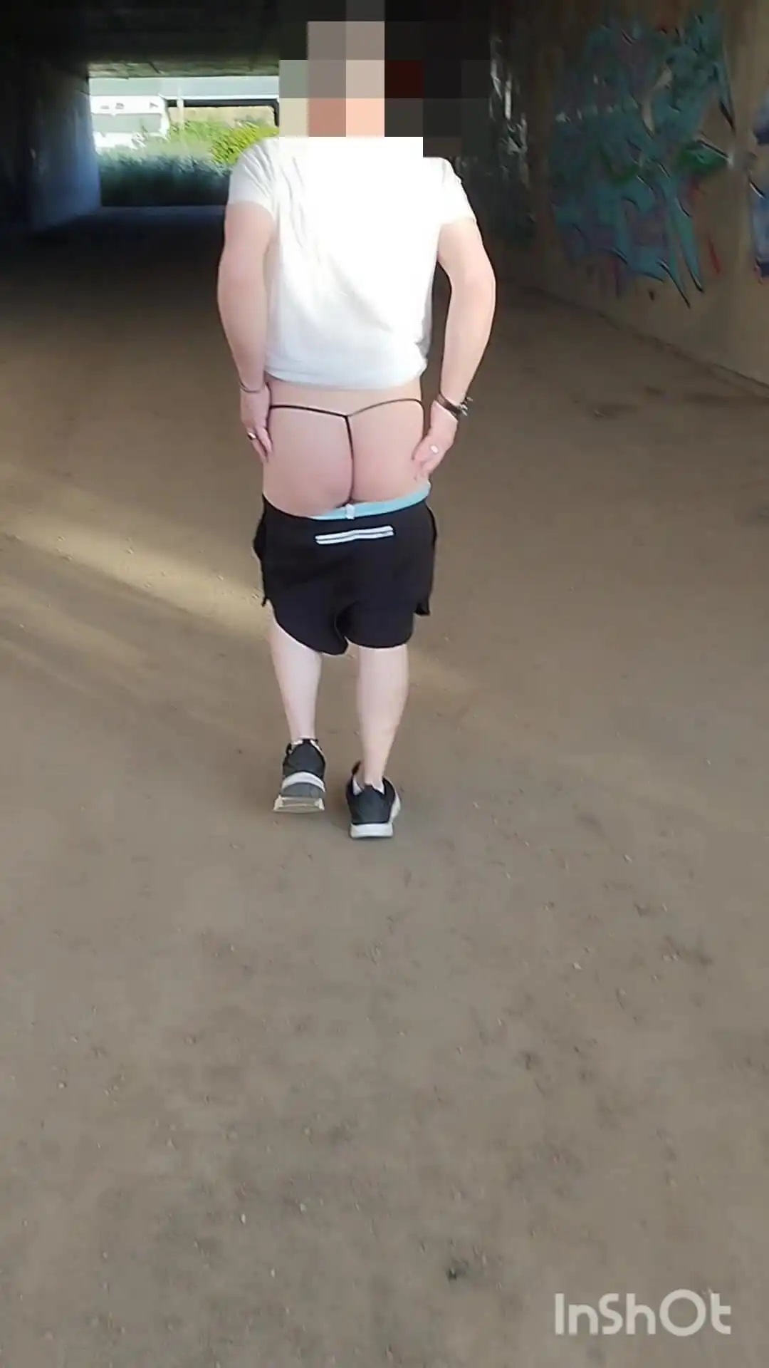 In Showing Her Ass in a Thong