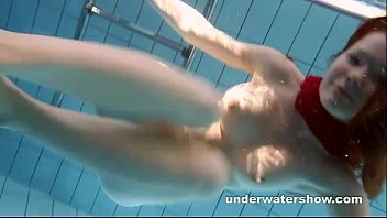 Redhead Mia Stripping Underwater