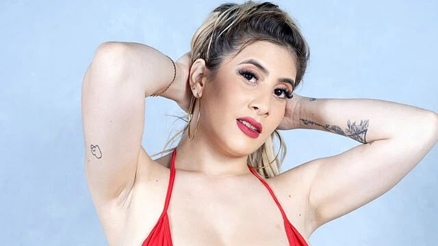 Big-boobed chick Charlotte Queen fucks with a rubber dildo