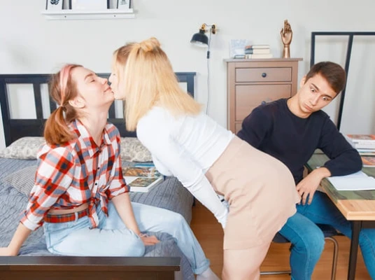 Irresistible cuties tease a lad